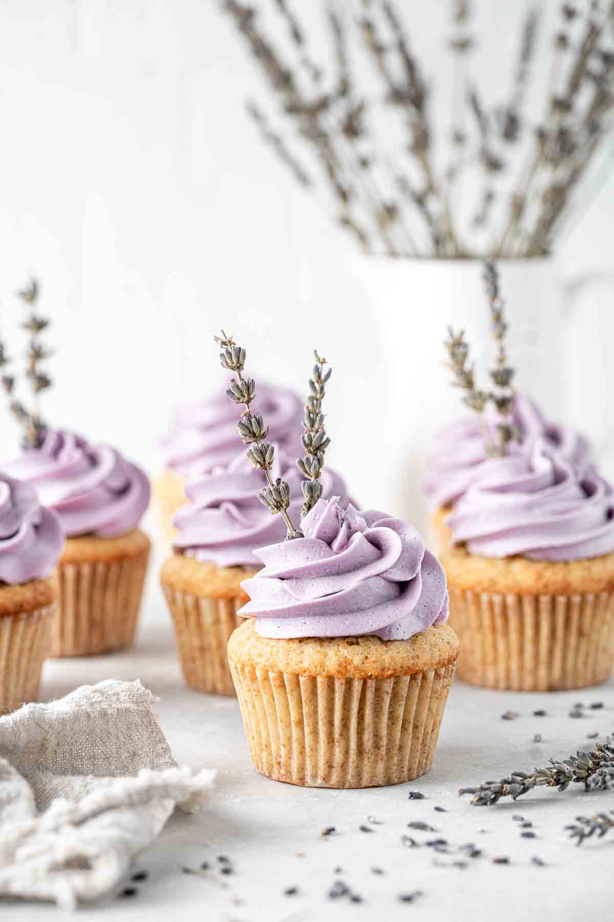 Earl grey lavender cupcakes with lavender sprigs.