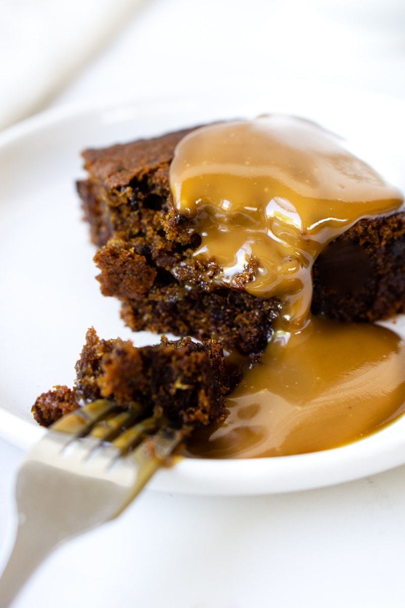 Sticky Date Pudding and Caramel Sauce with Bite Taken
