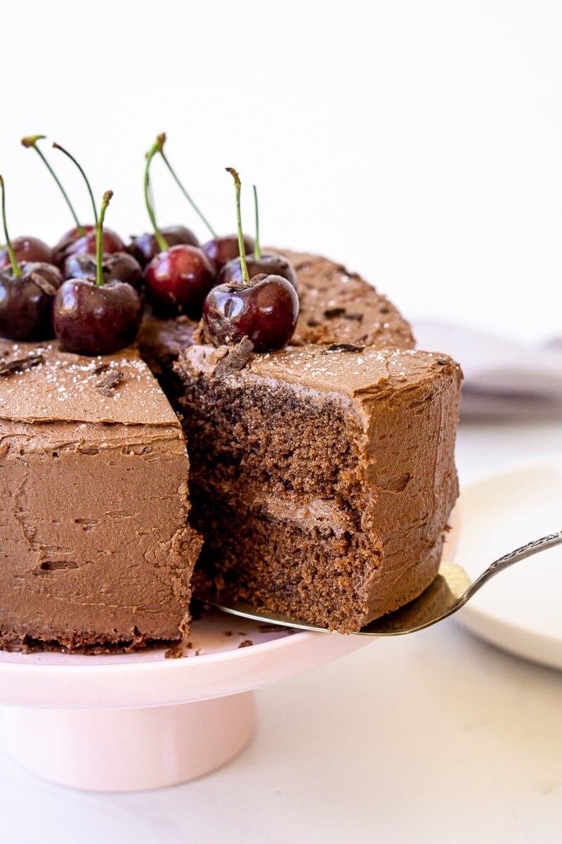 Chocolate cherry cake with a slice being served