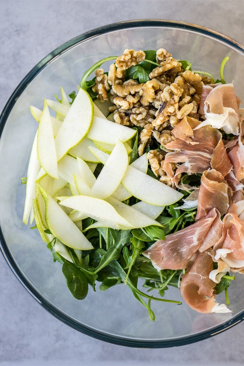Pear and Prosciutto Salad ingredients in a bowl