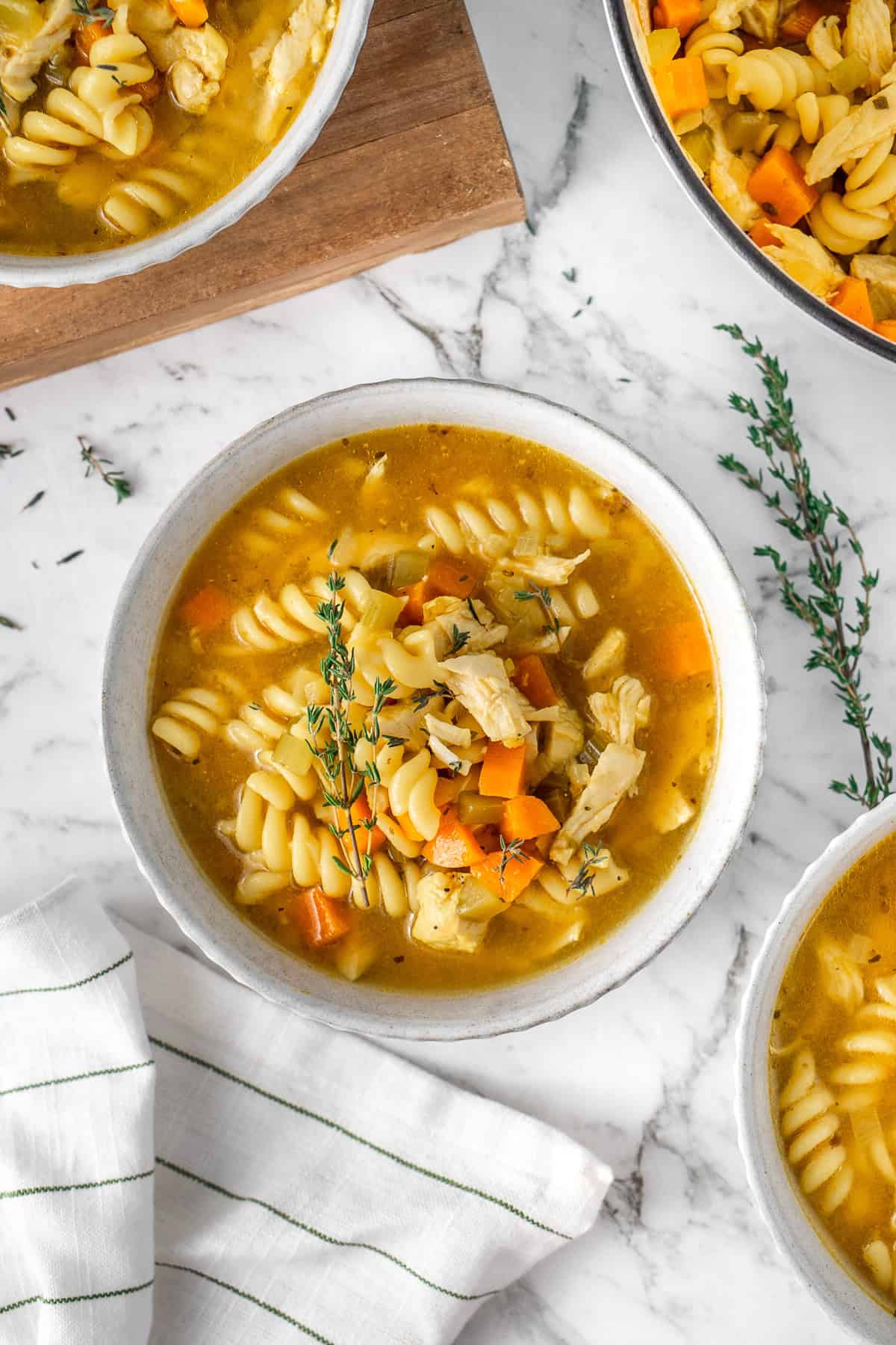 The healing chicken soup served into bowls.