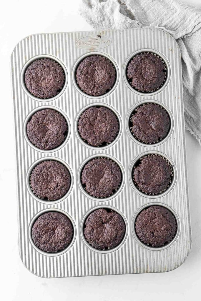 Chocolate cupcakes in the pan fresh from the oven.