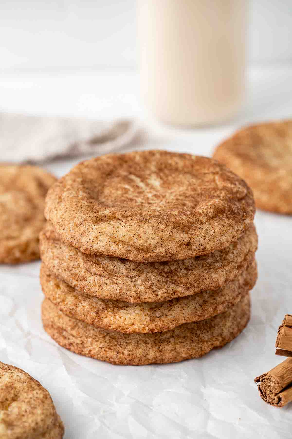 Four snickerdoodle cookies stacked on top of each other.
