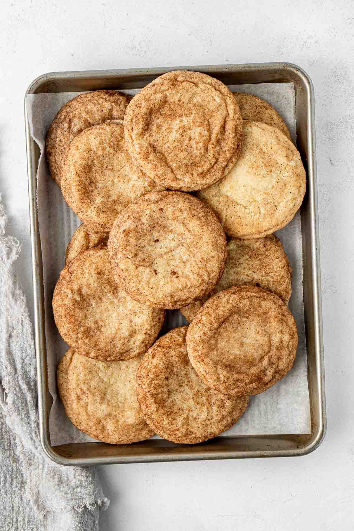 A baking tray of snickerdoodle cookies.