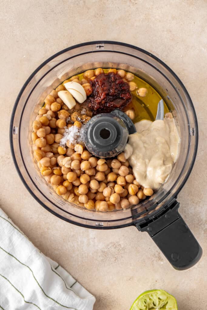 All ingredients for the hummus in the food processor.