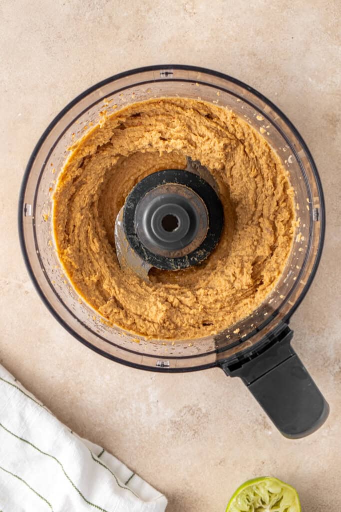 The blended hummus in the food processer.