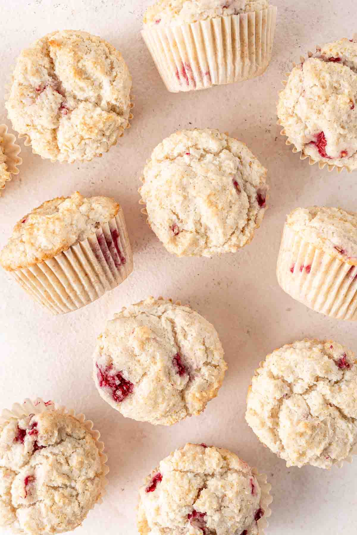 Gluten free raspberry muffins laid out.