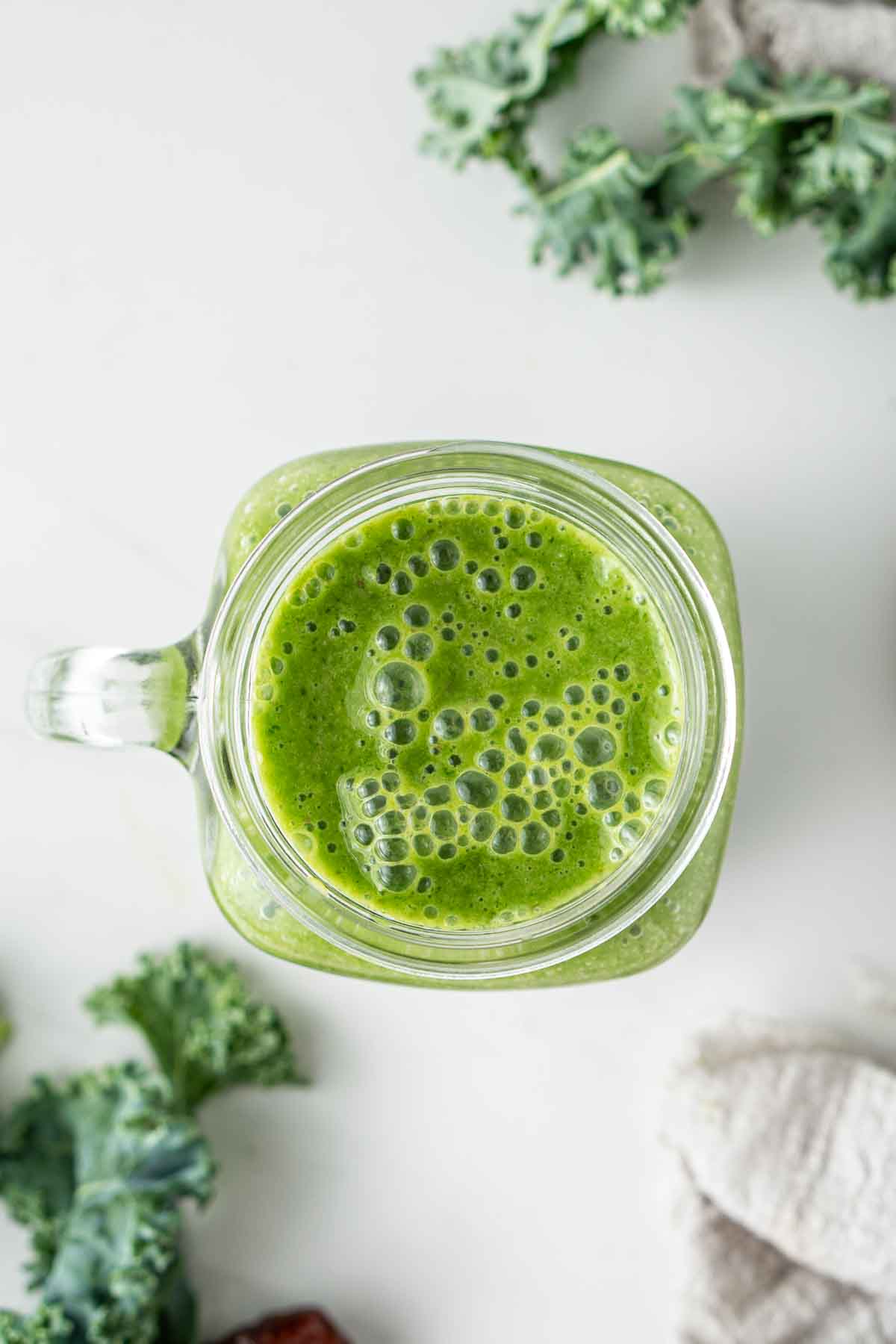 Green smoothie from the top served in a glass.