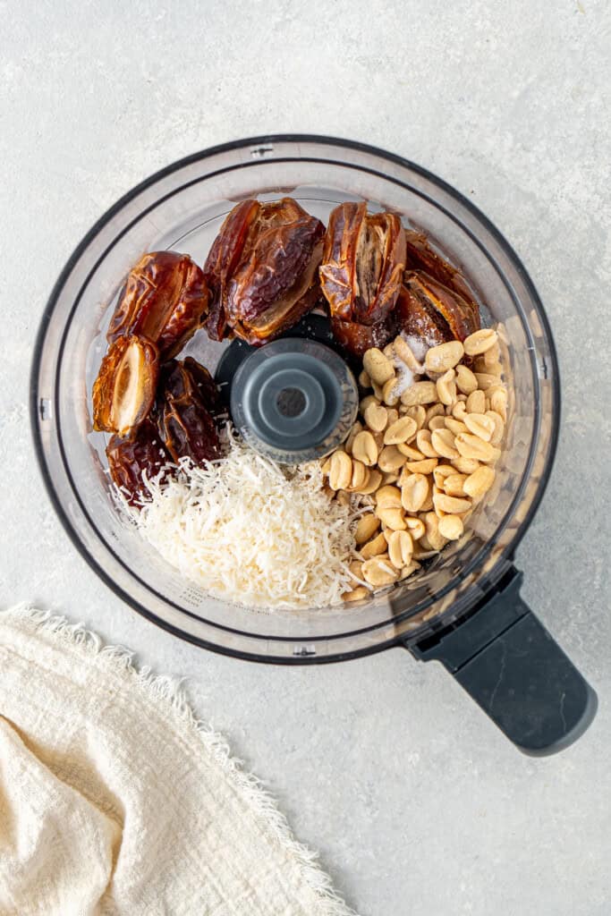 All ingredients in the bowl of a food processor.