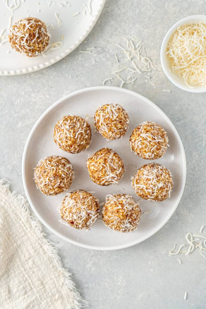 The balls on a plate coated in coconut.