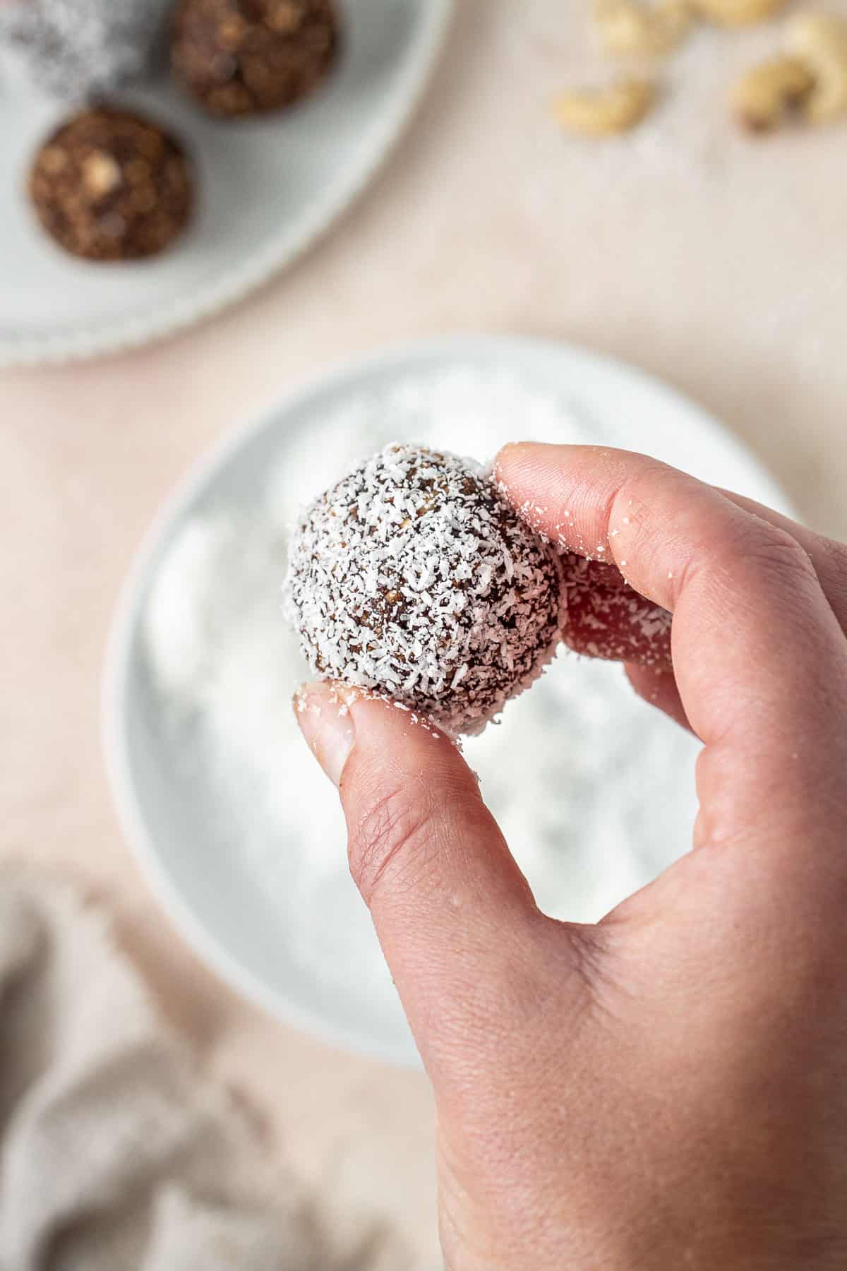 Rolling balls in coconut.