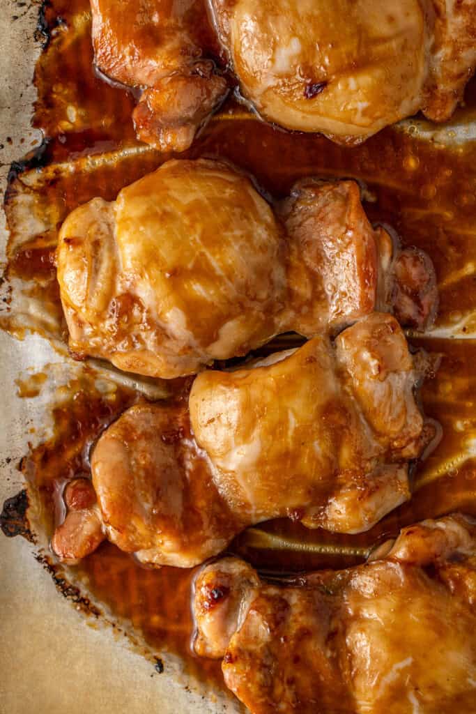 The cooked chicken on a baking tray.