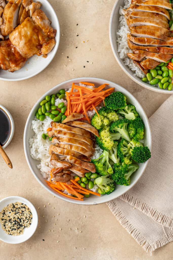 Assembling the chicken and rice bowls.