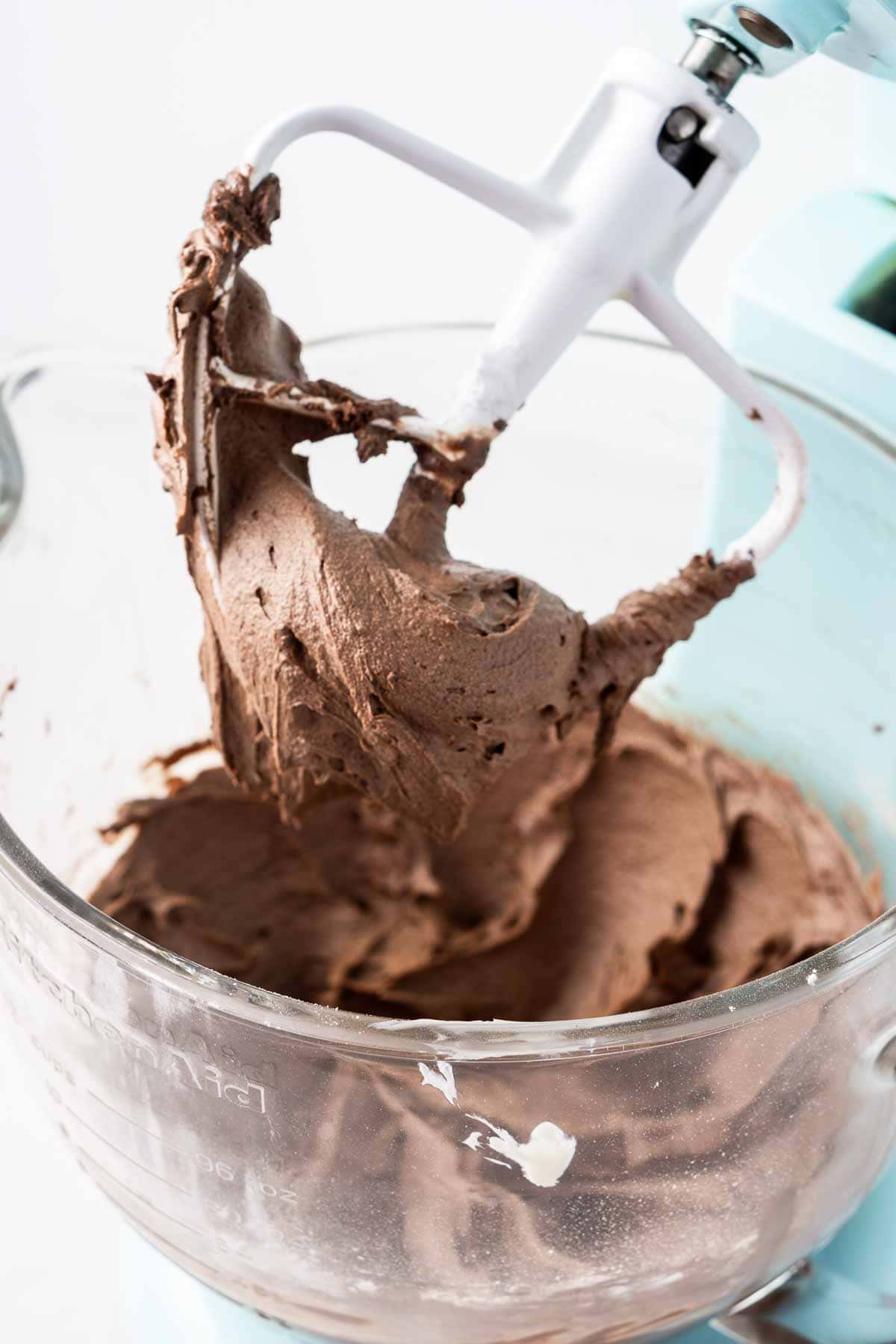 Creamy vegan chocolate buttercream in a stand mixer.