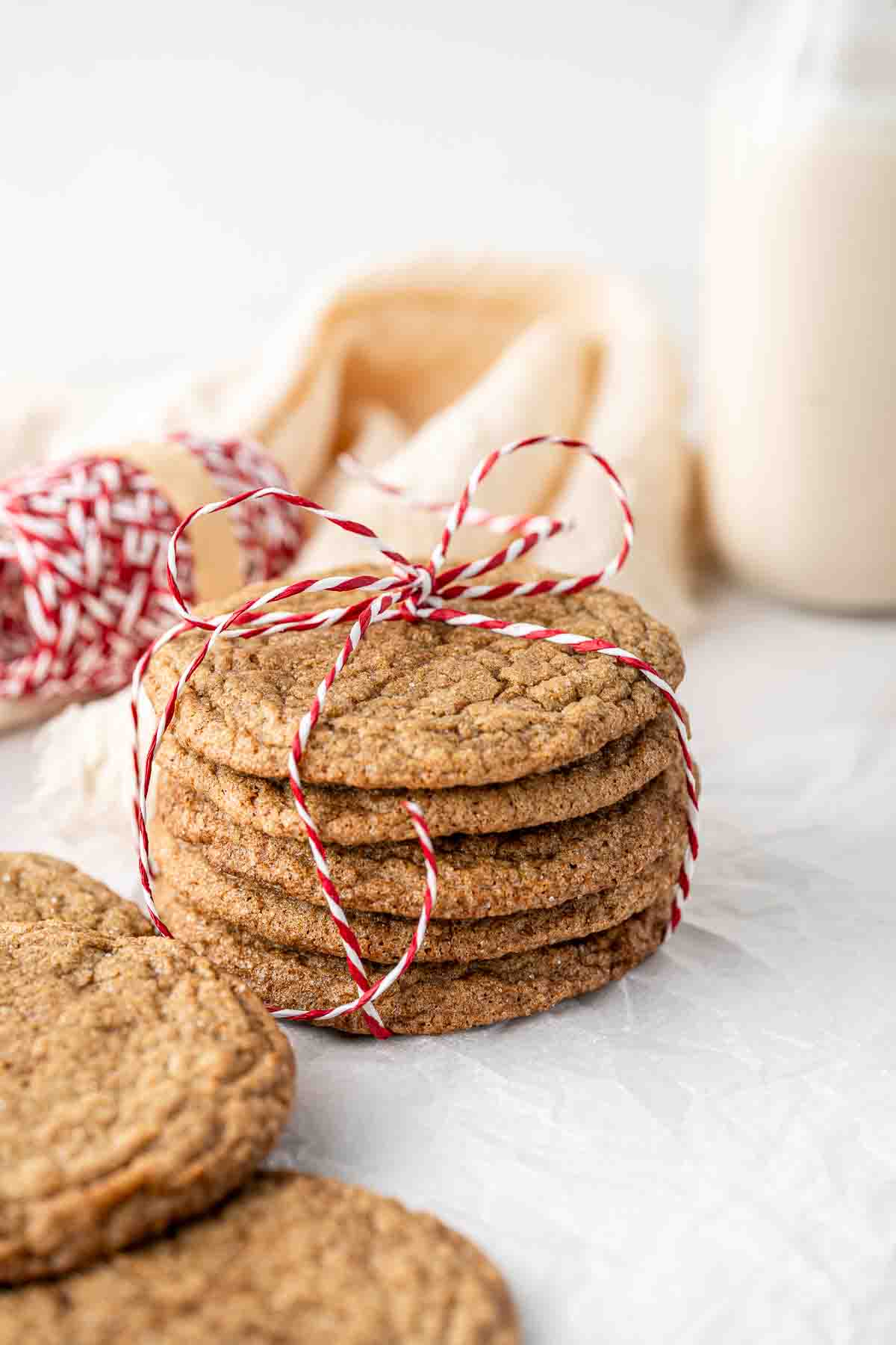 Ginger snap biscuits in a stack tied up with Christmas string. 