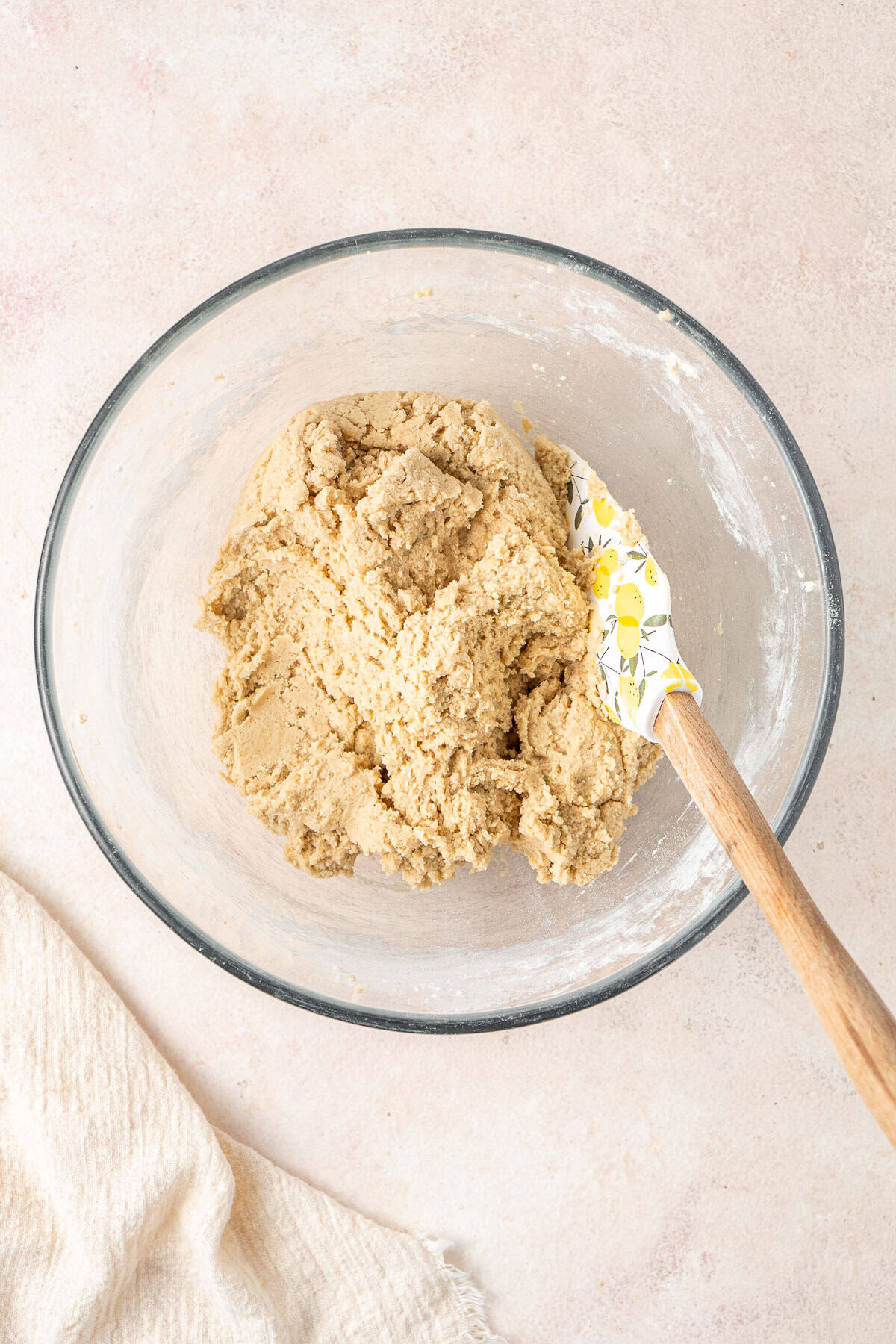 The mixed cookie dough in a glass bowl.