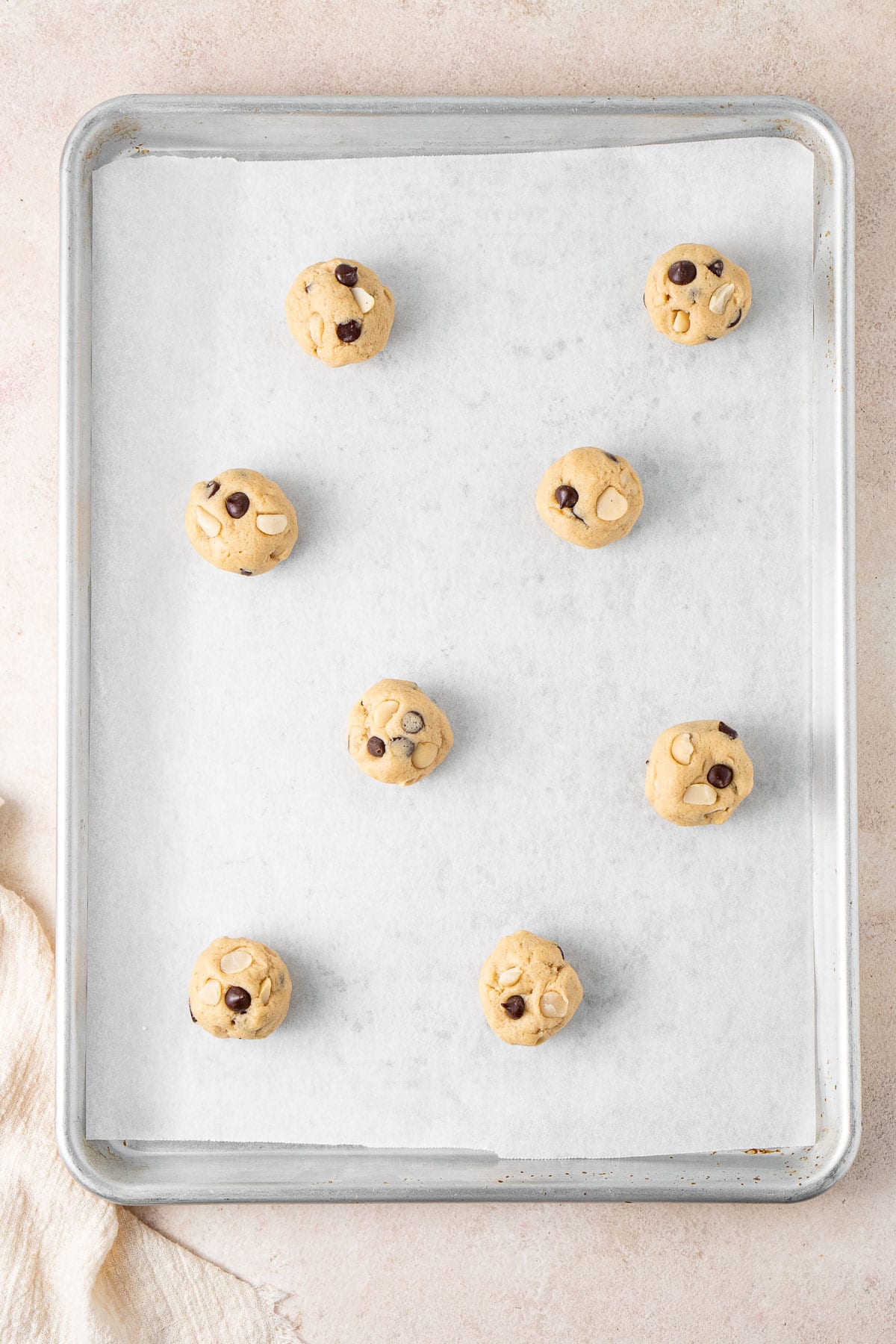 Cookie dough balls on a baking tray.