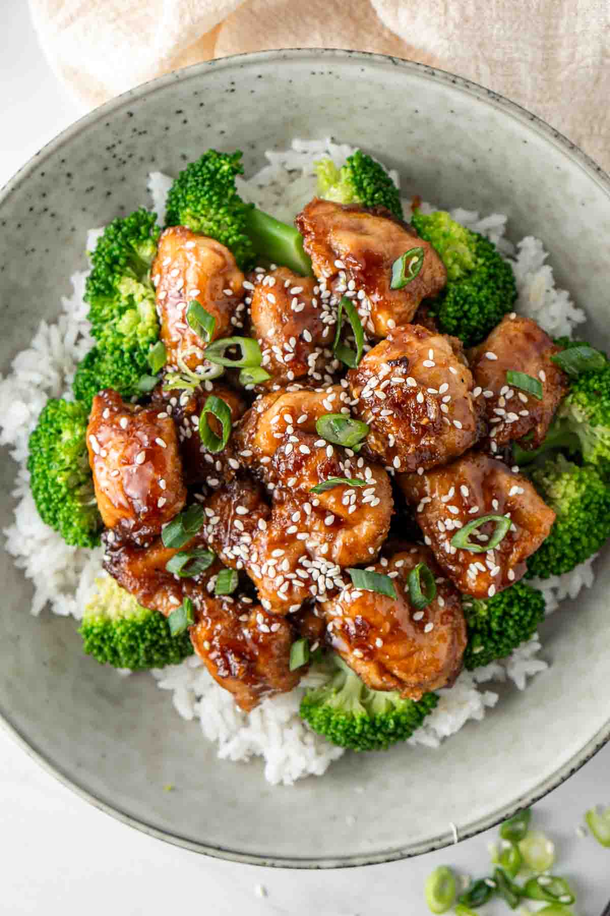 Close up of honey soy chicken in a bowl.