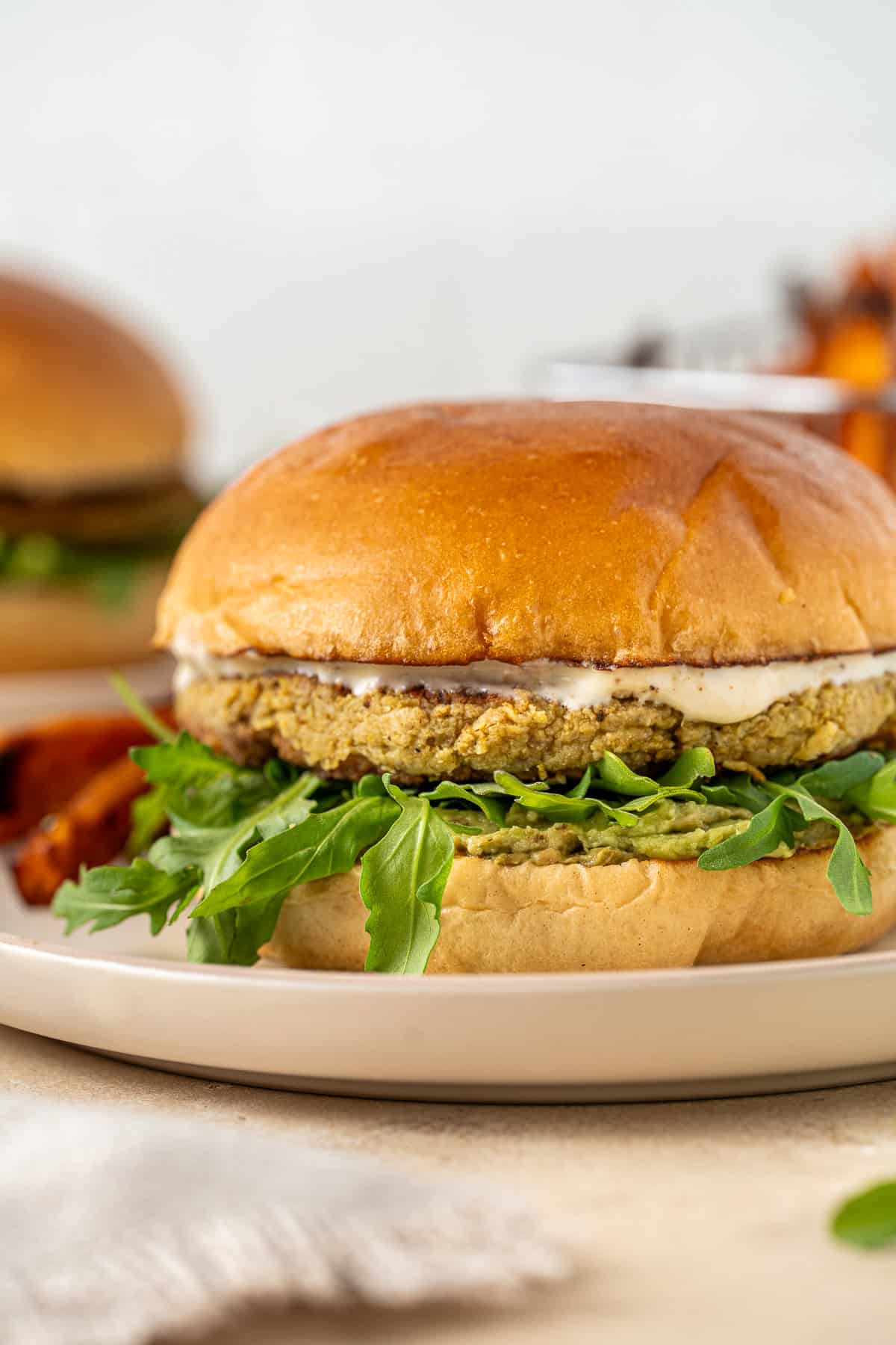 Close up of an assembled chickpea and cauliflower burger.