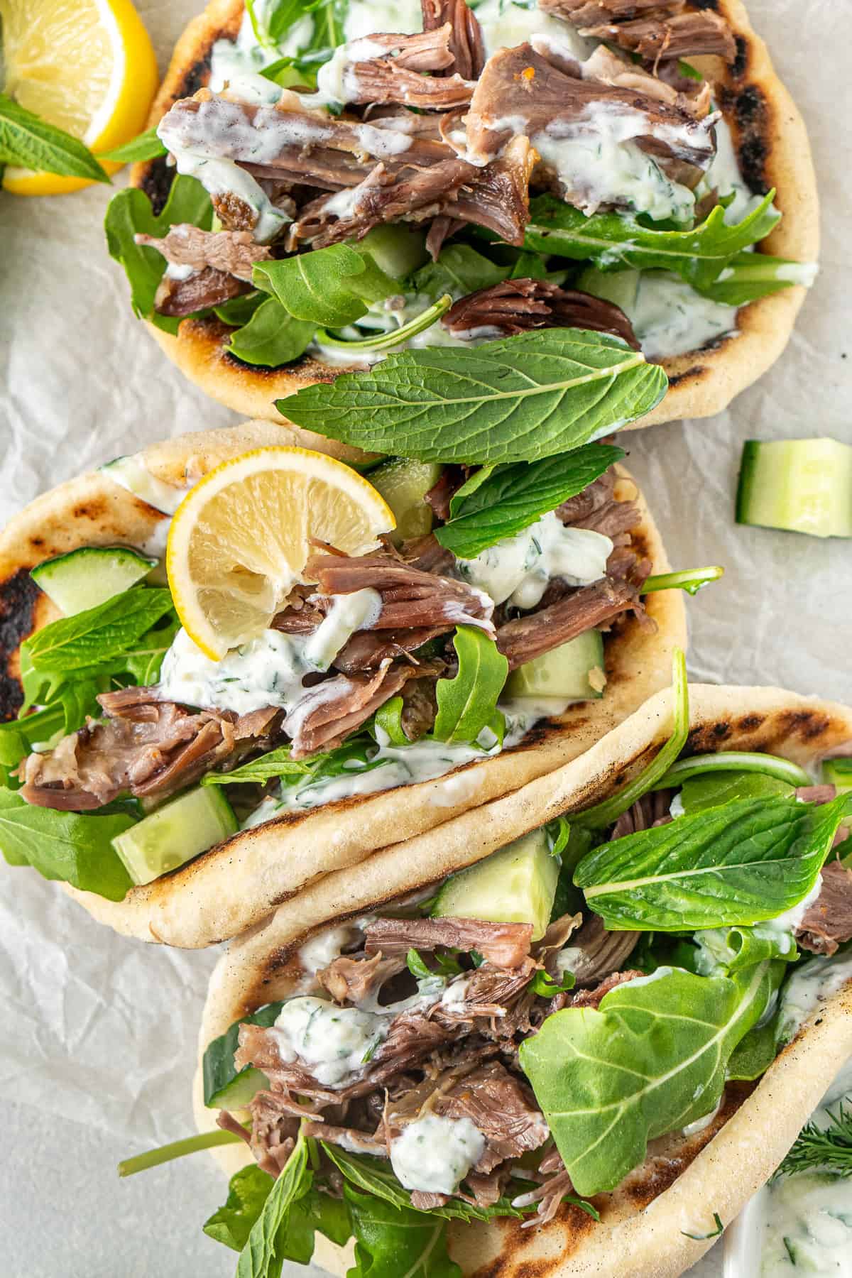 The Greek lamb pitas with fresh mint and lemon to serve.