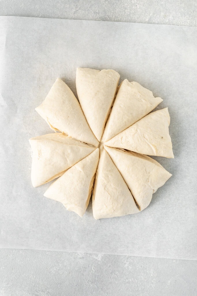 Dividing up the pita dough.