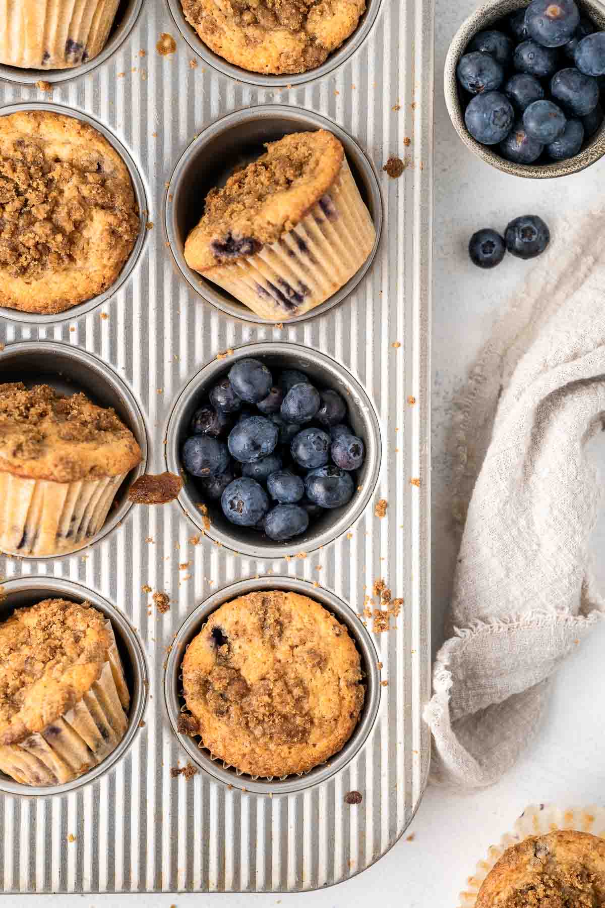 Blueberry earl grey muffins in a muffin pan.