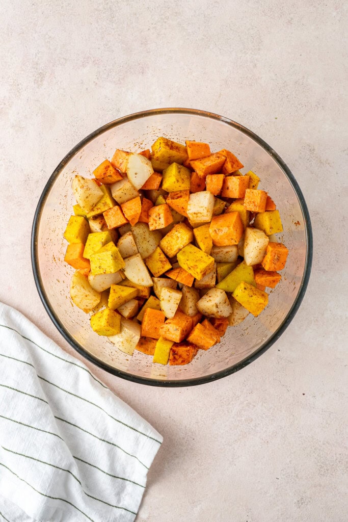 Starchy vegetables in a glass mixing bowl.