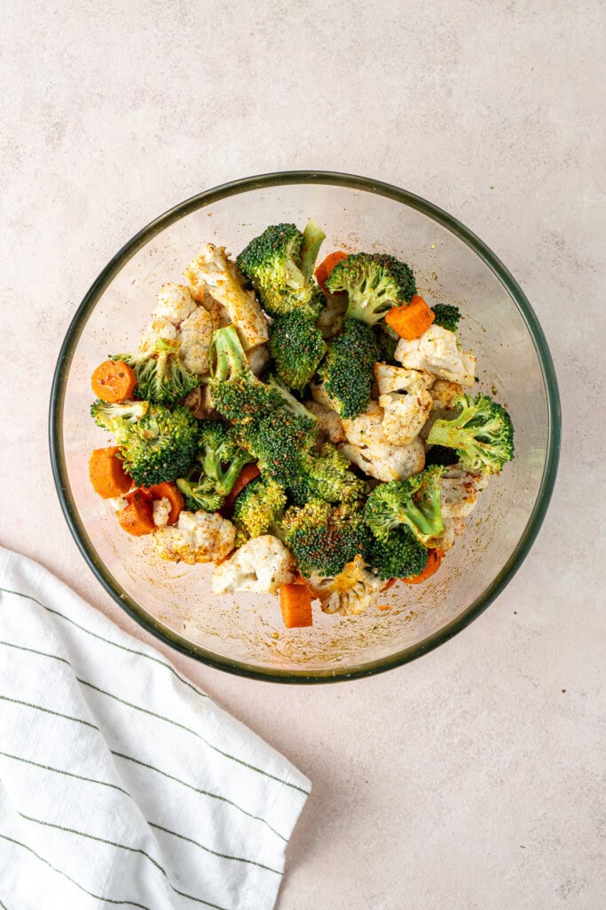 Vegetables in a glass mixing bowl.