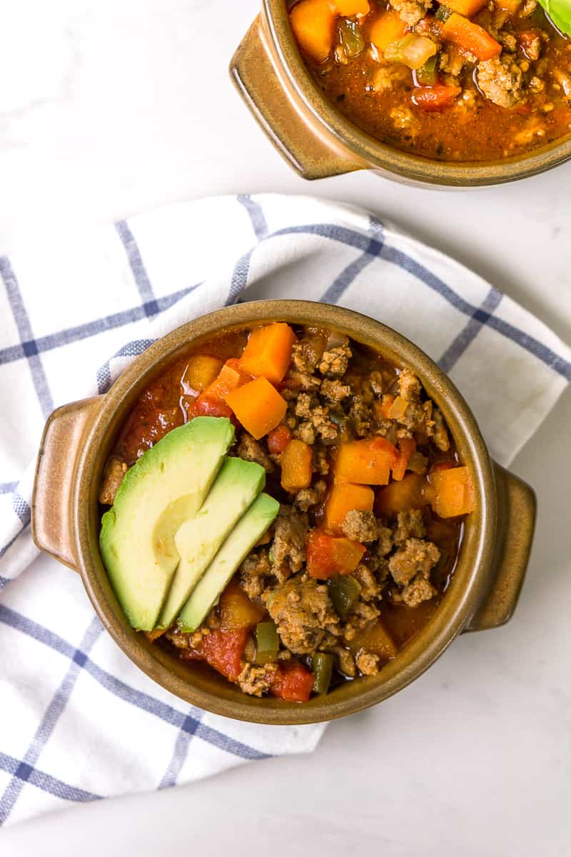 Slow cooker Whole30 Chilli in bowls with avocado 