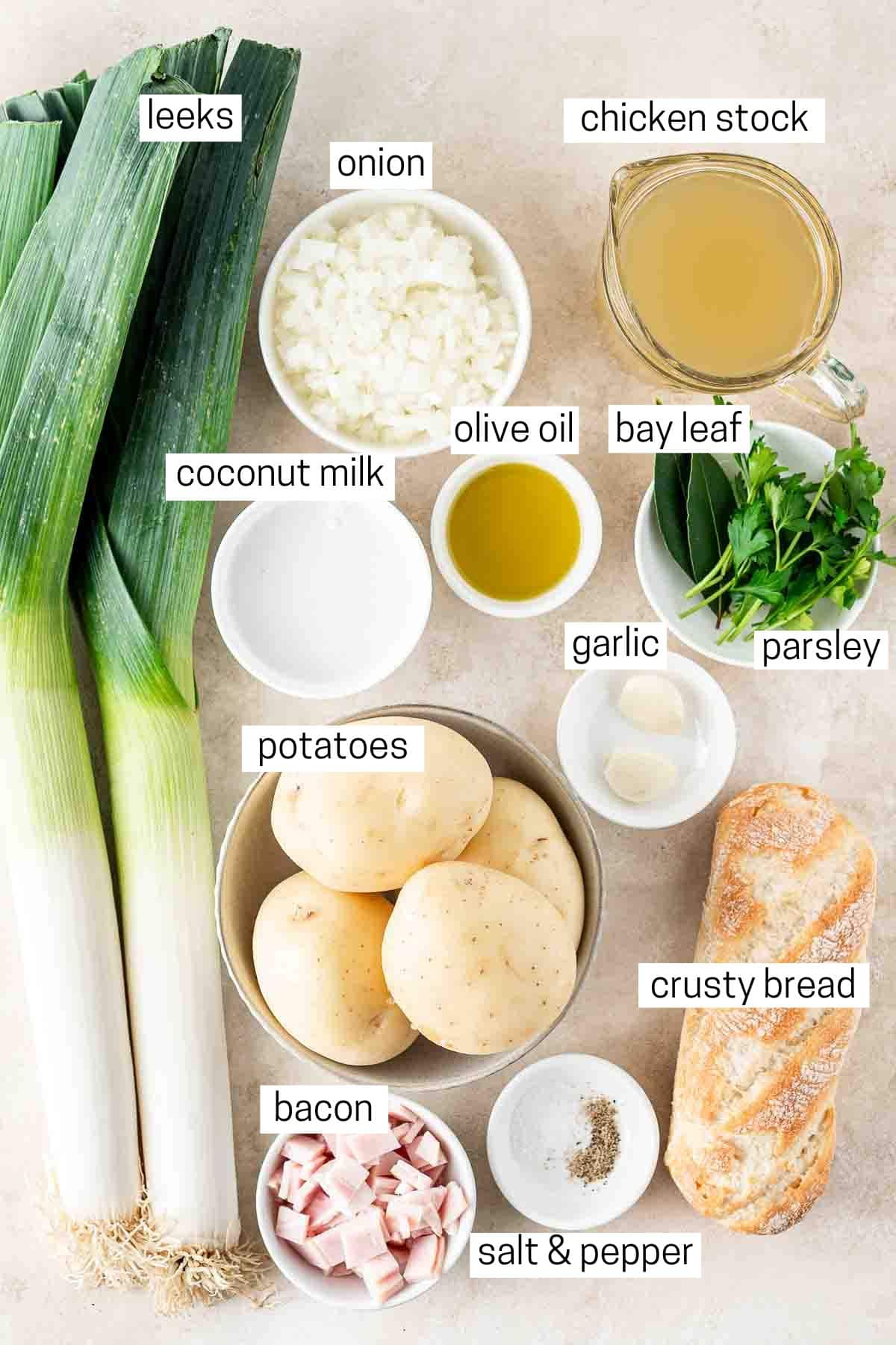 All ingredients needed for potato and leek soup laid out in bowls.