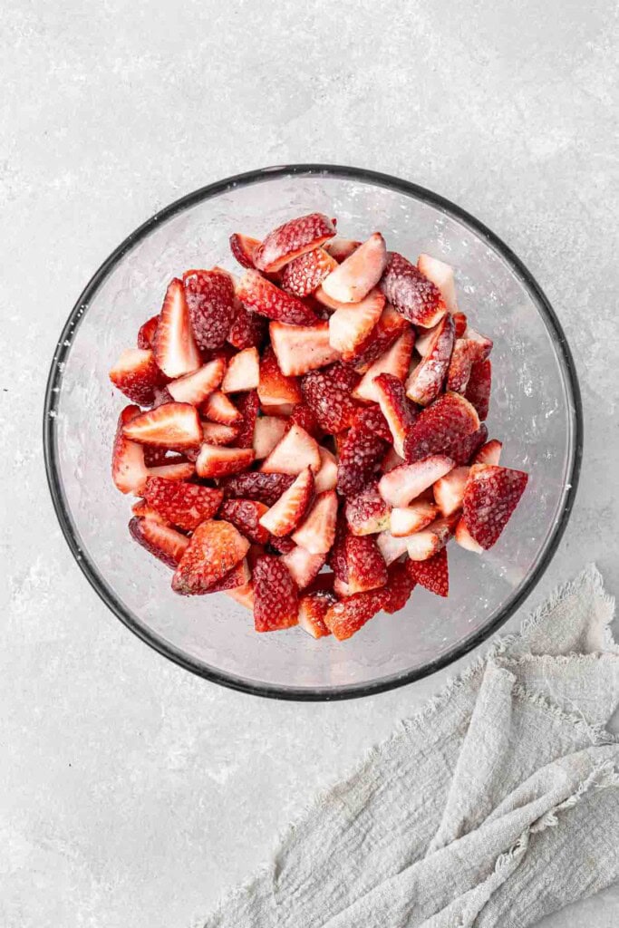 Macerated strawberries in a glass  bowl.