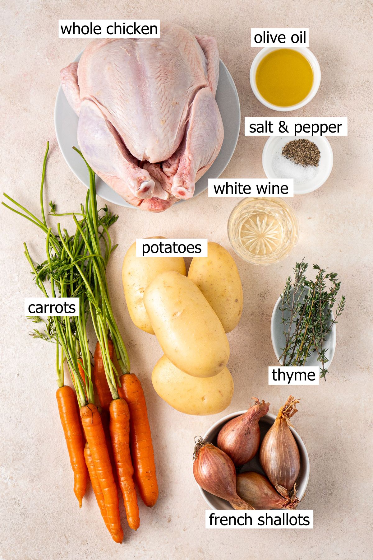 All ingredients needed to make a one pan roast chicken laid out in bowls.