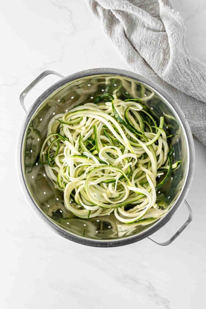 Spiralised zucchini noodles in a colander. 