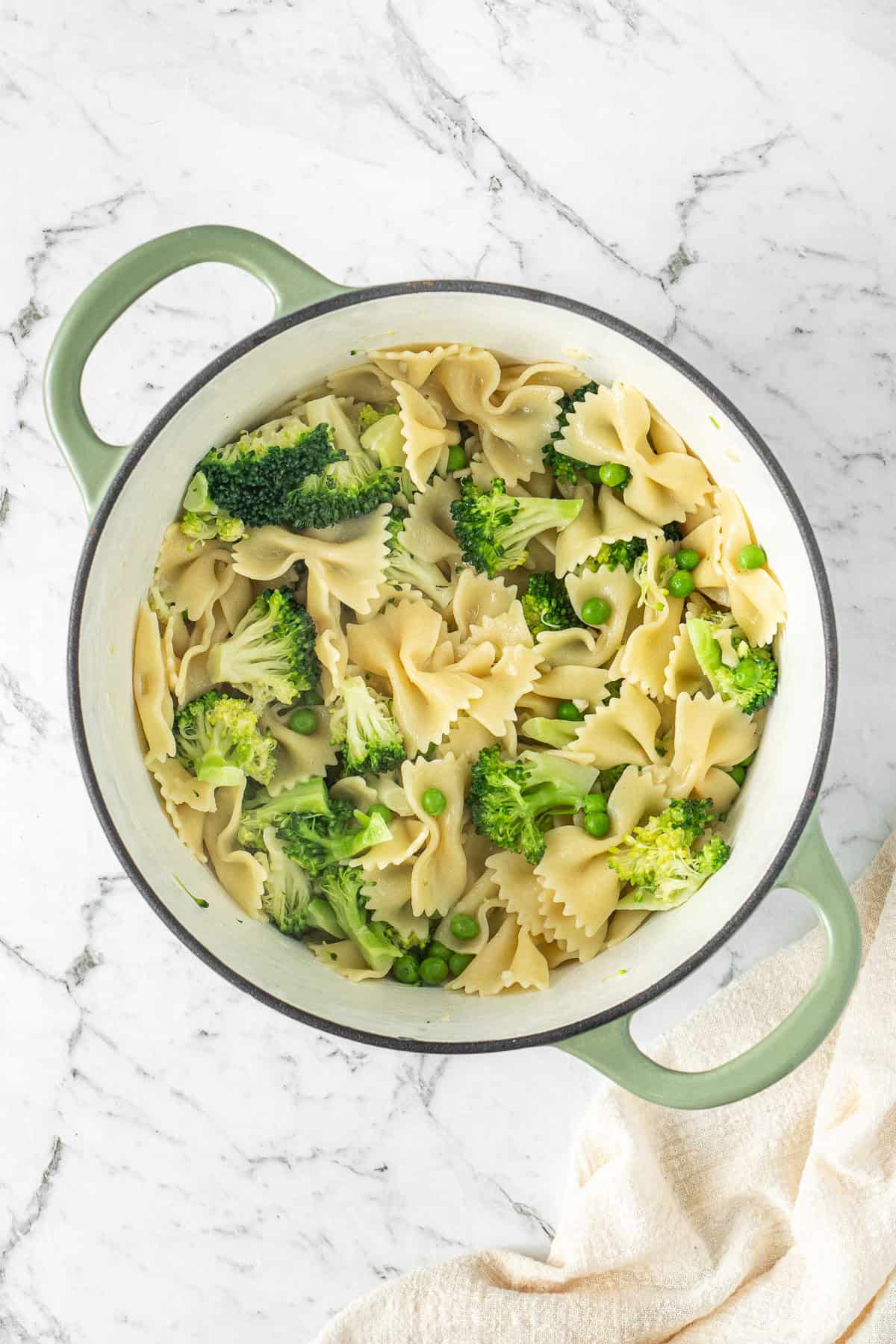 The drained pasta and veg added back to the pot.