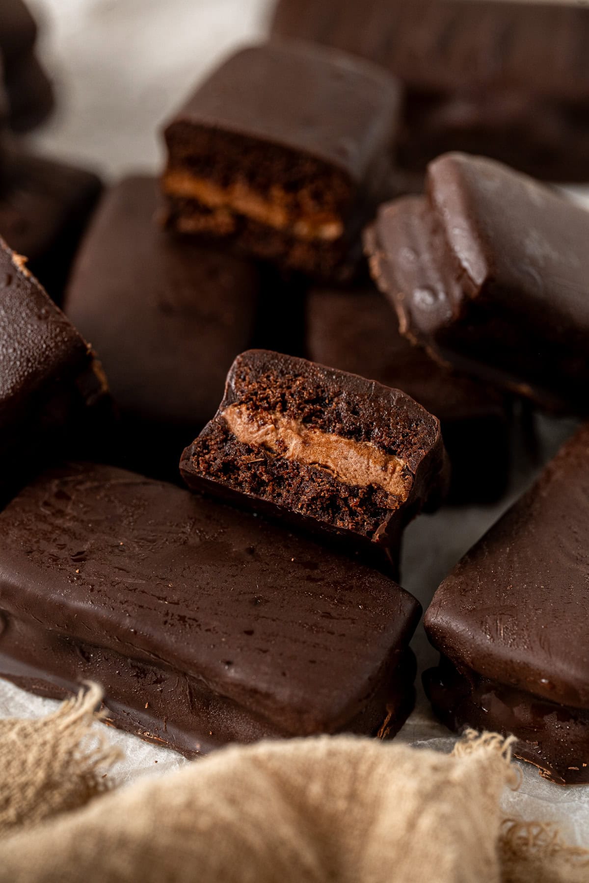 A close up of a Tim Tam cut in half.