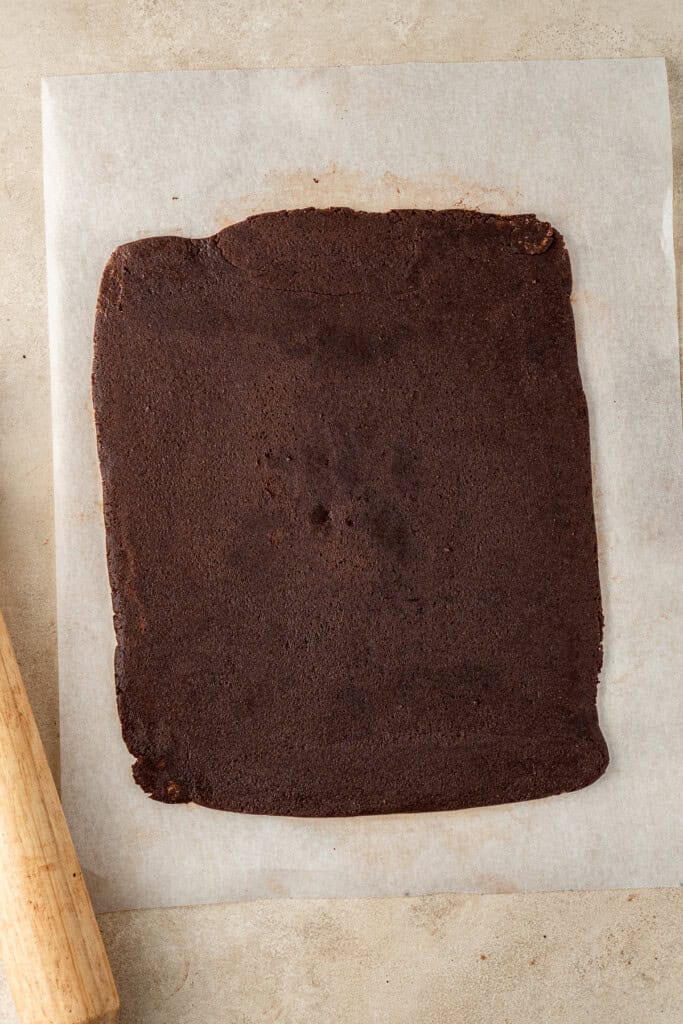 Rolling out the chocolate cookie dough.