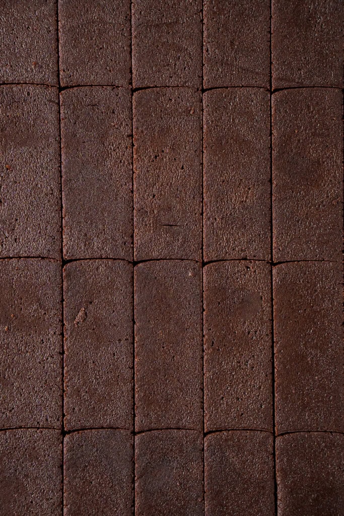 Cutting the cookie dough into rectangles. 