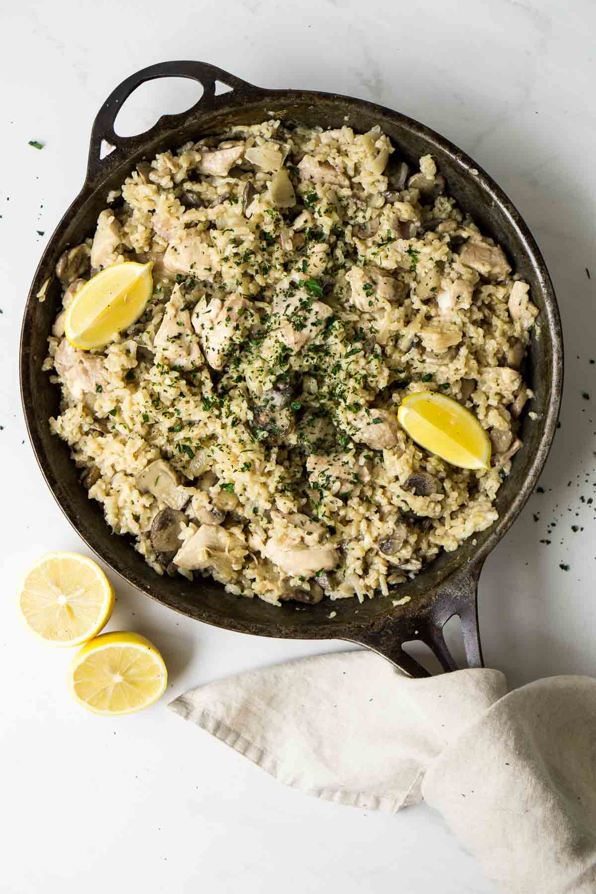 Oven Baked Chicken and Mushroom Risotto in a large cast iron skillet