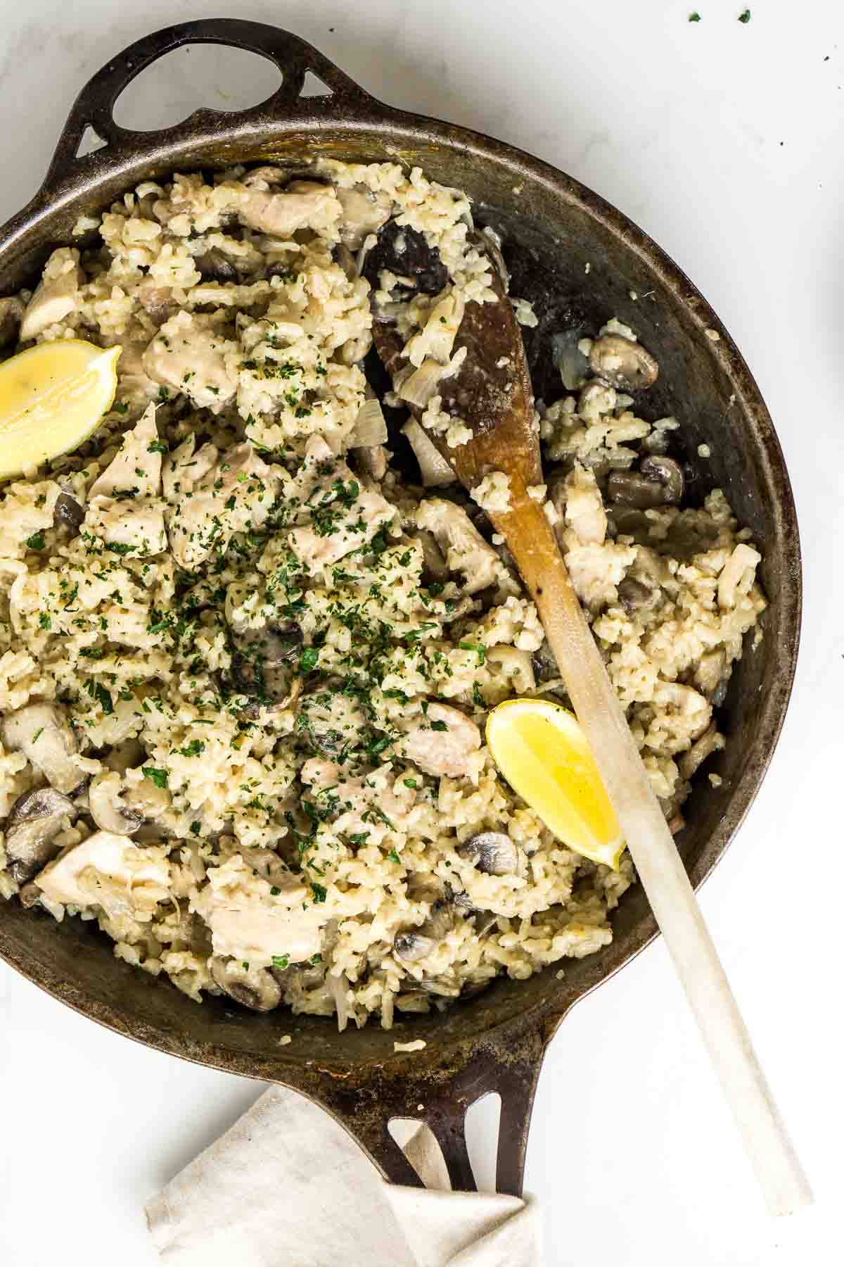 Oven Baked Chicken and Mushroom Risotto in a large cast iron skillet