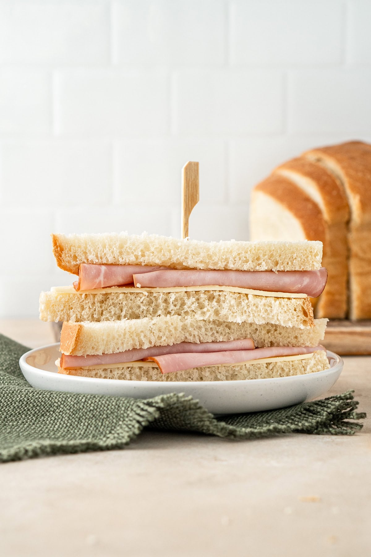 A ham and cheese sandwich on homemade bread.