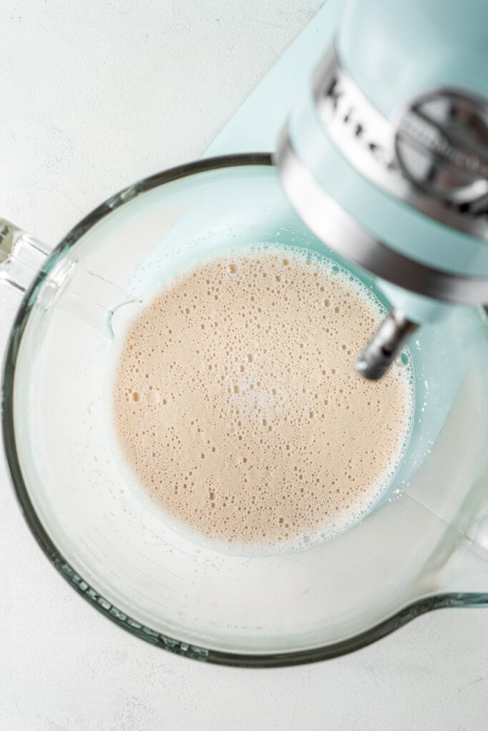 Blooming the yeast in the bowl of a stand mixer.