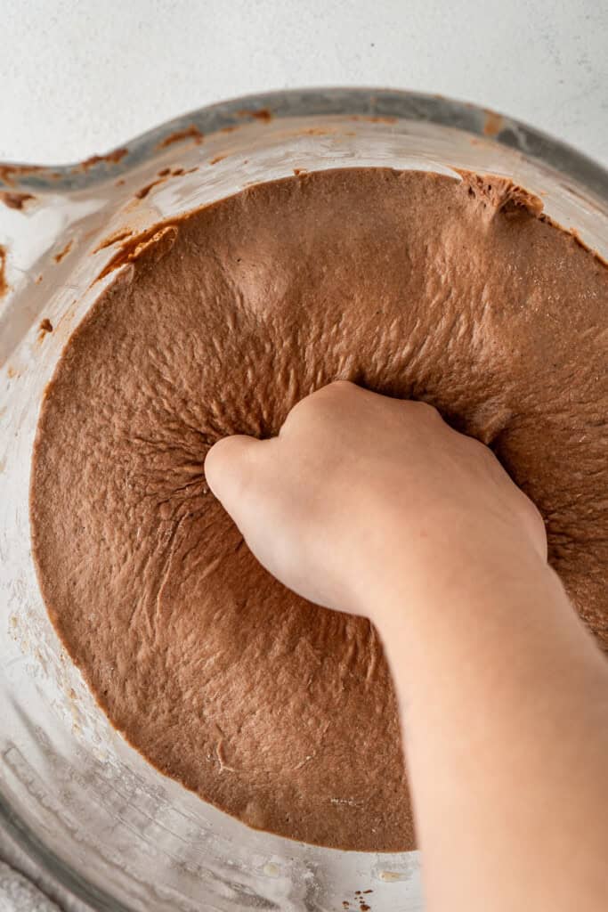 Punching down the dough.