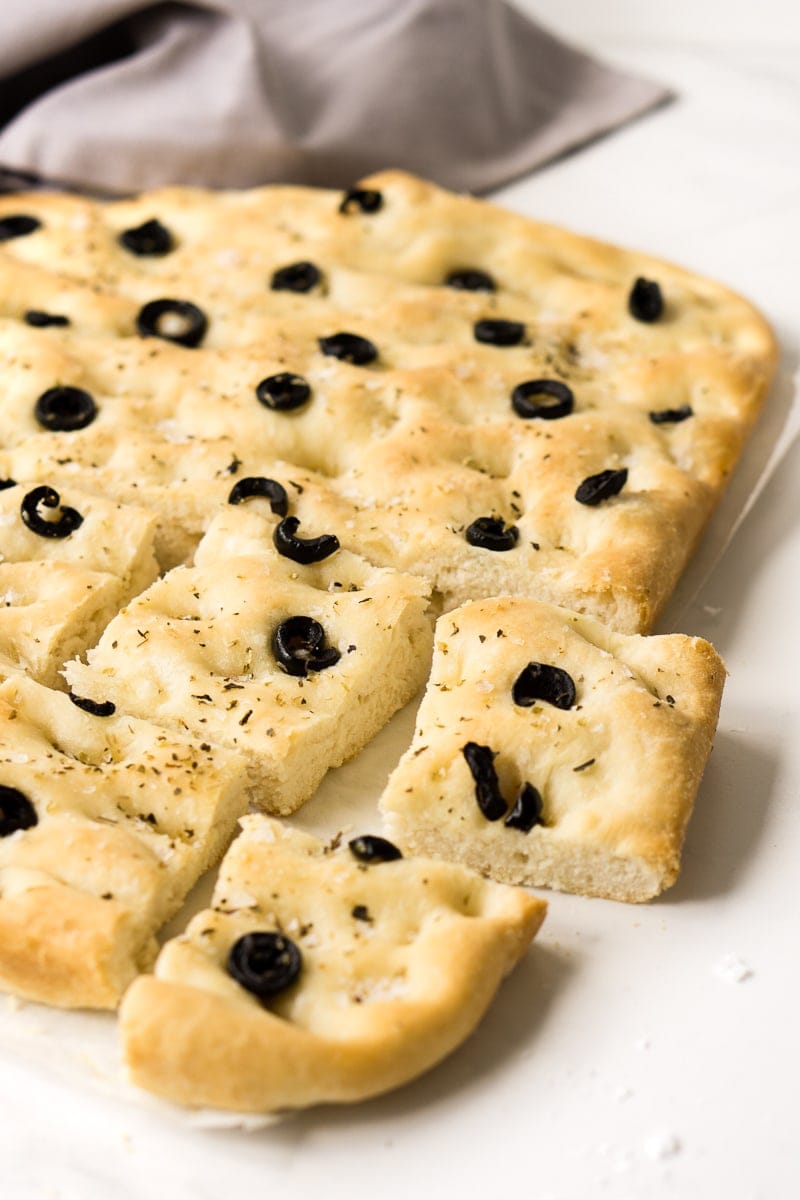 Olive and Herb Focaccia cut up on table