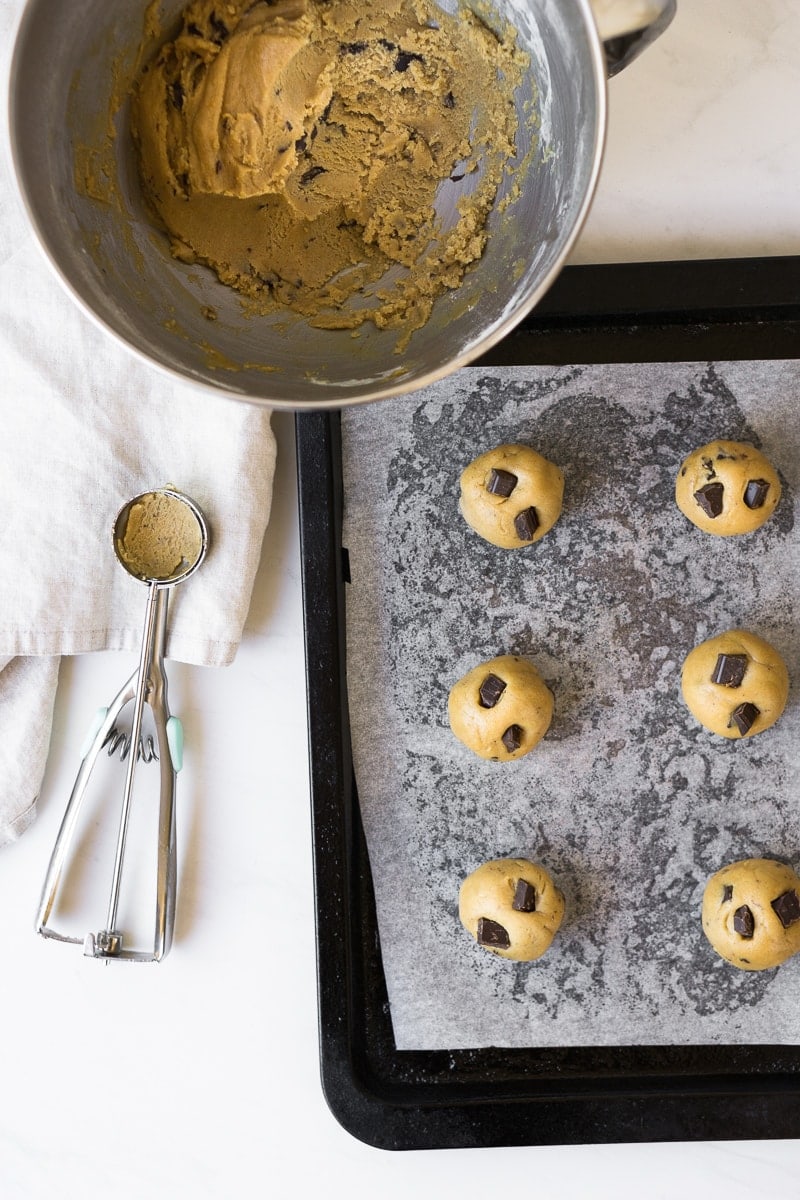 Raw cookie dough balls on tray