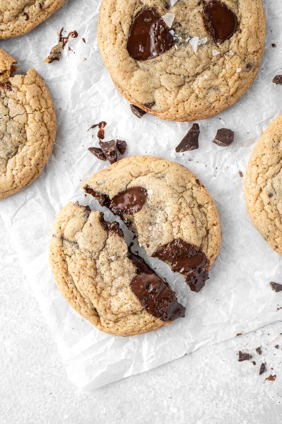 Close up of a dairy free chocolate chip cookie broken in half.