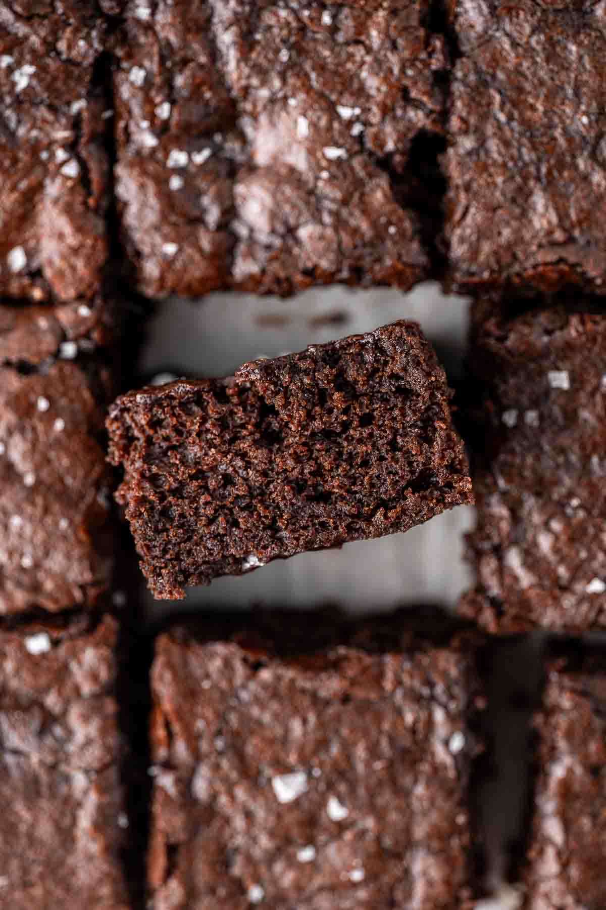 Close up of the sides of a square of vegan brownies.