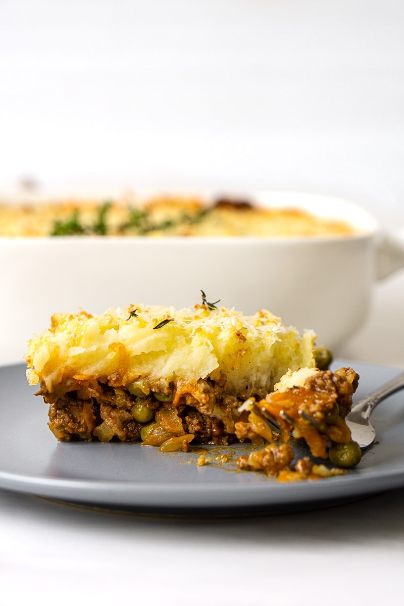 Cottage pie on a plate with a fork