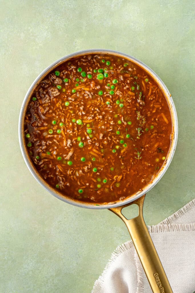 The liquids added to the mince ready to simmer.