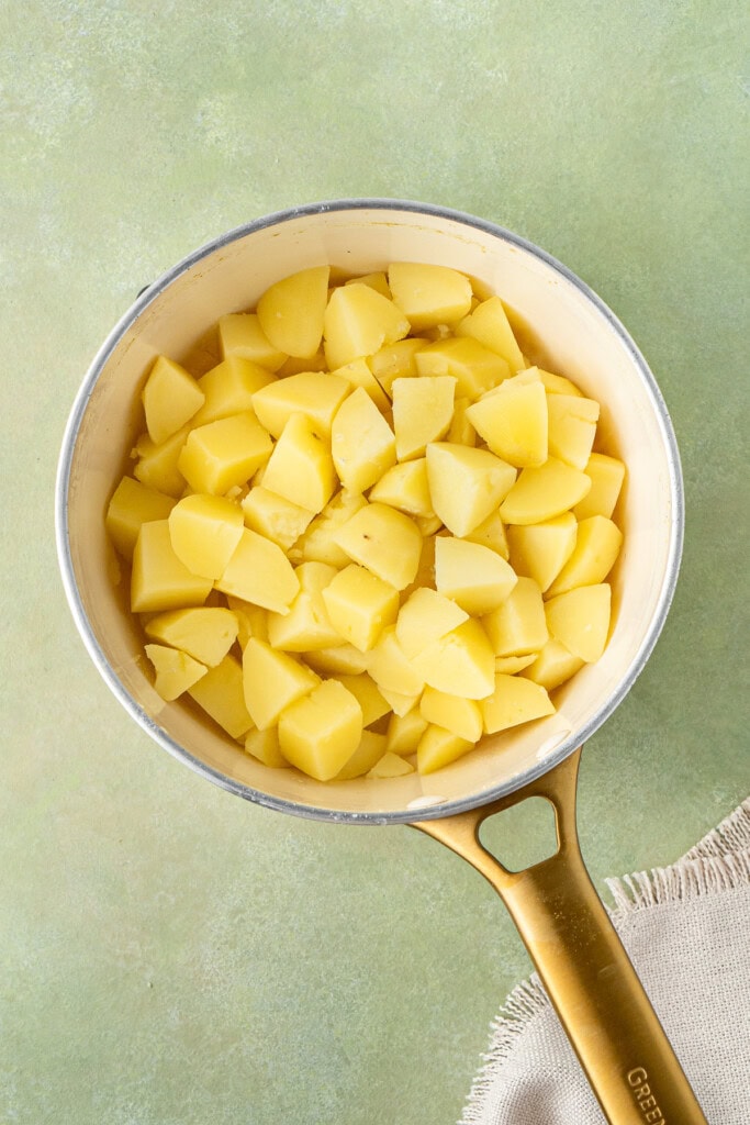 Boiling potatoes in a pot.