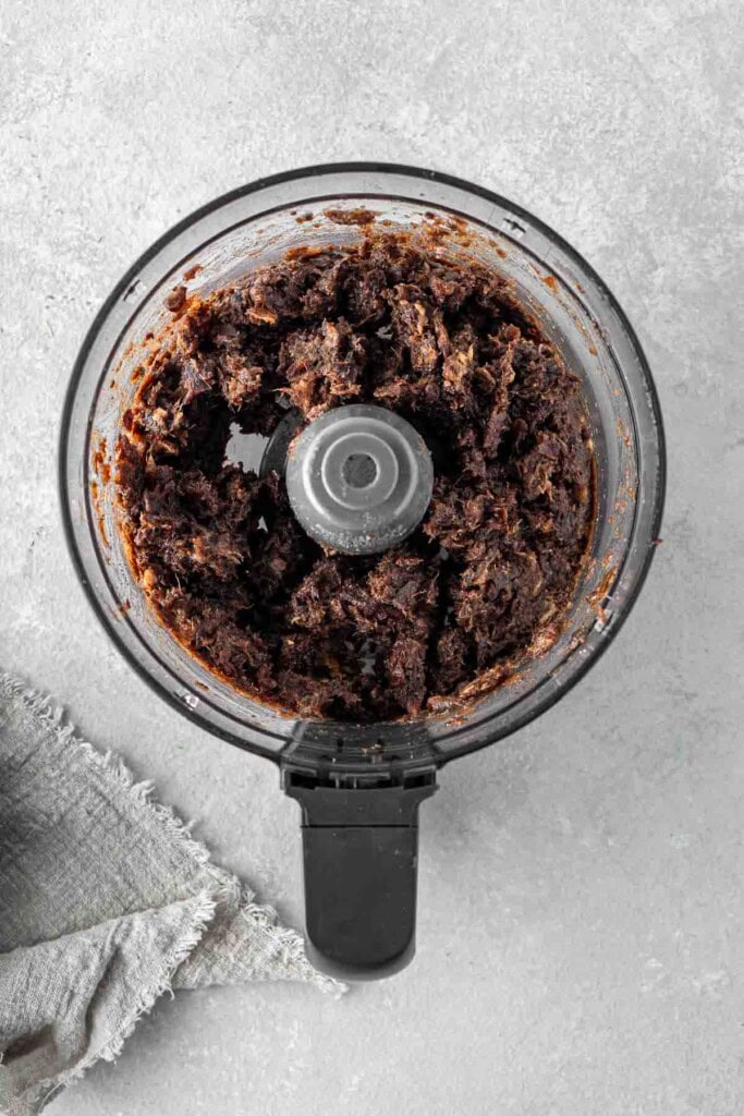 Chopping dates in a food processor.